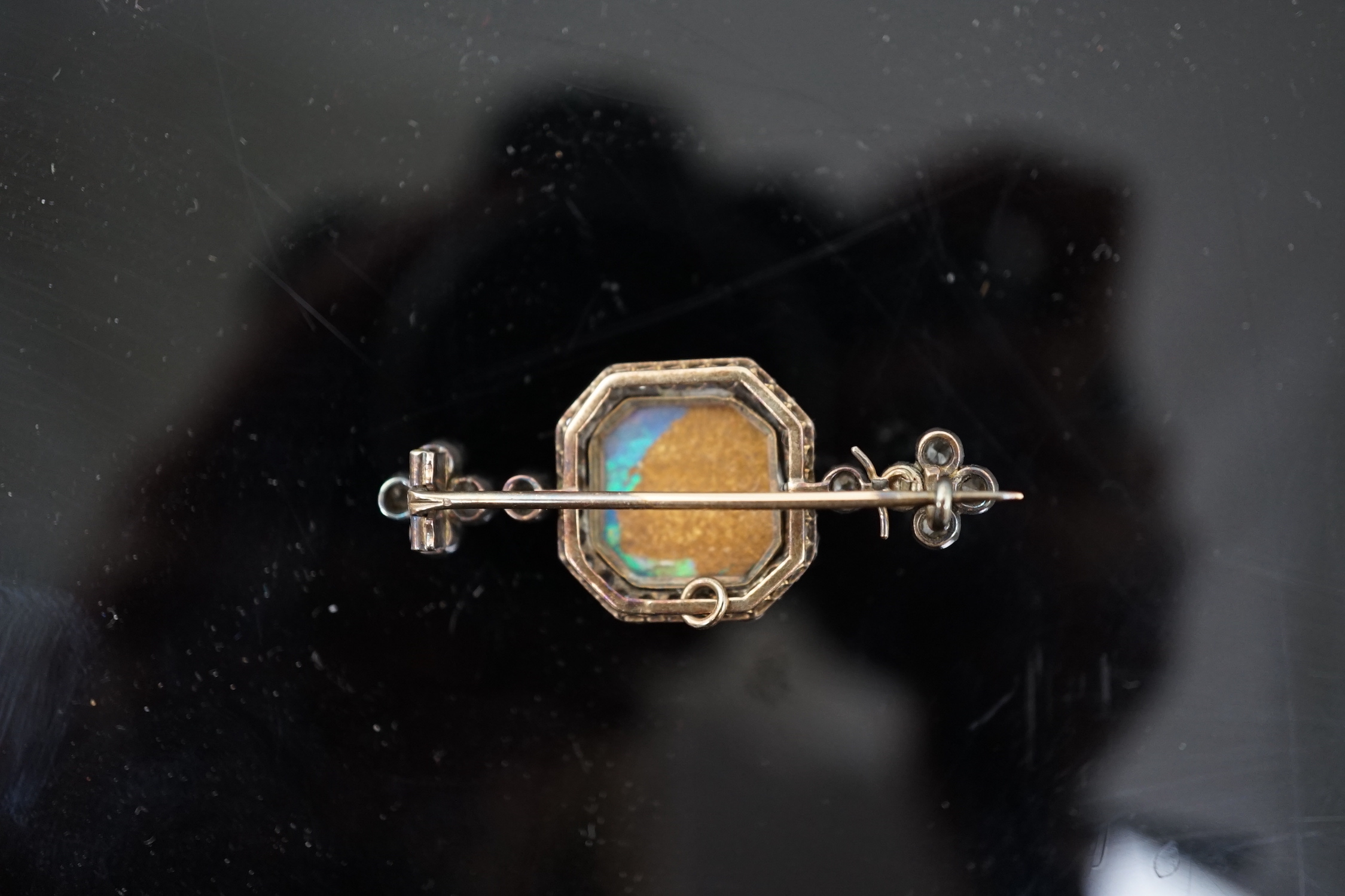 A late Victorian gold and silver, black opal and diamond cluster bar brooch